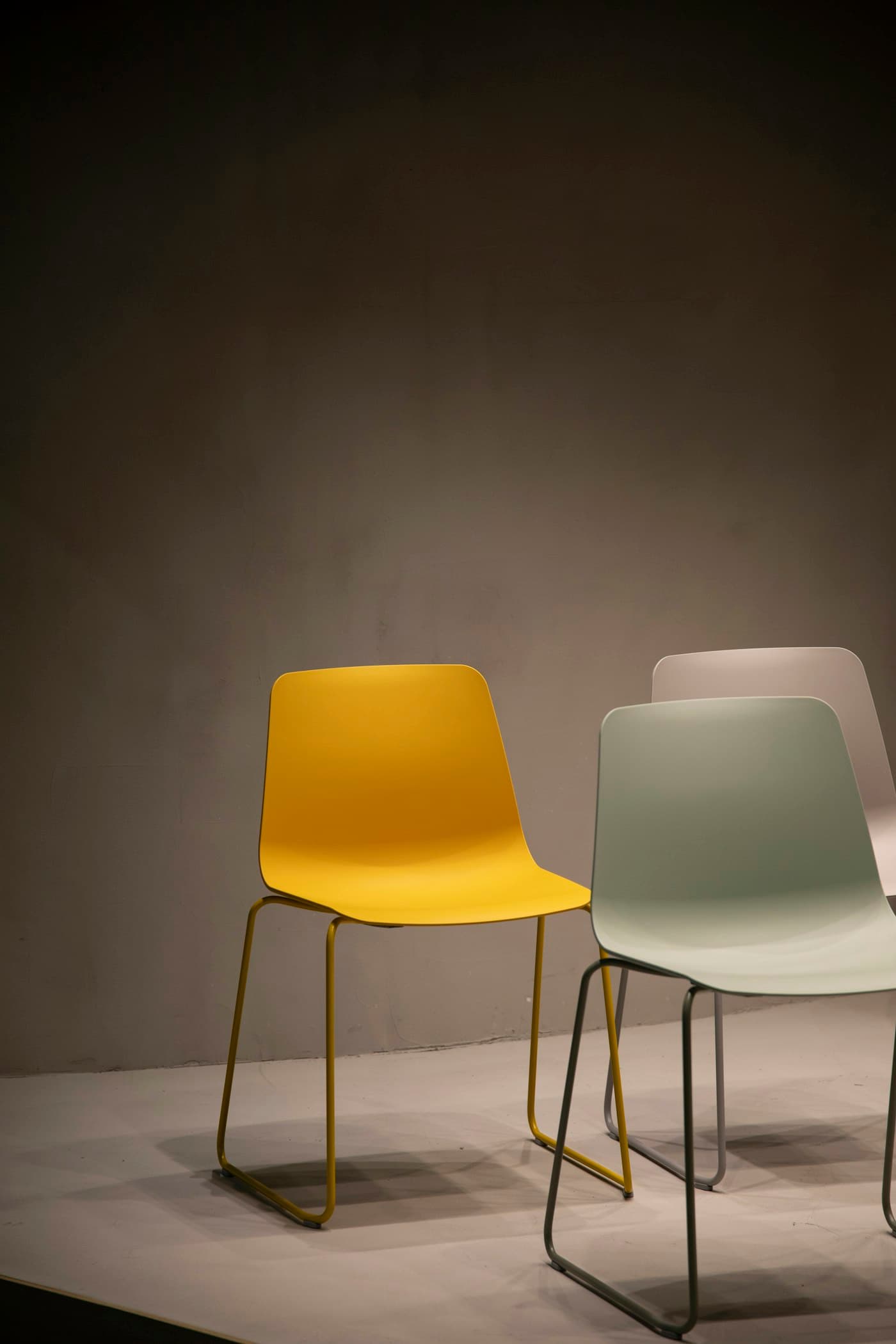Pair of moulded side chairs on slim steel legs